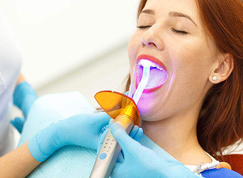 A woman having dental work done.