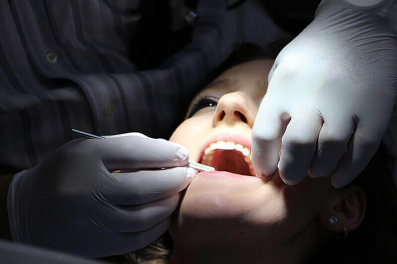 A woman having dental work performed.