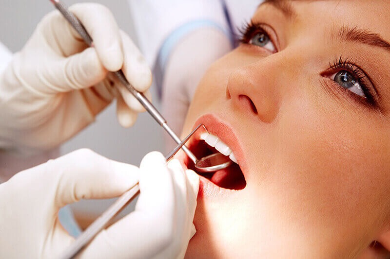 A woman having dental work performed.