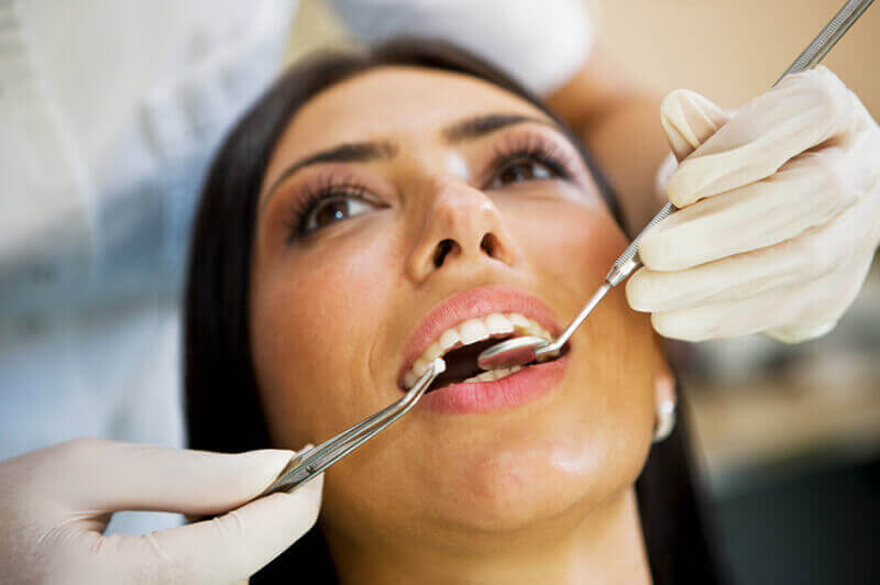 A woman having dental work performed.