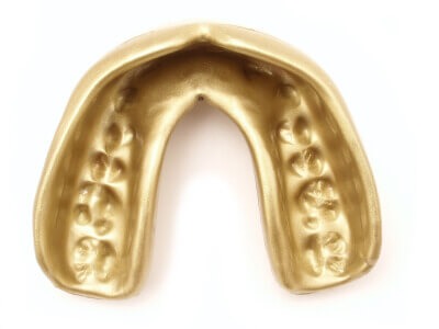 A gold mouthguard.